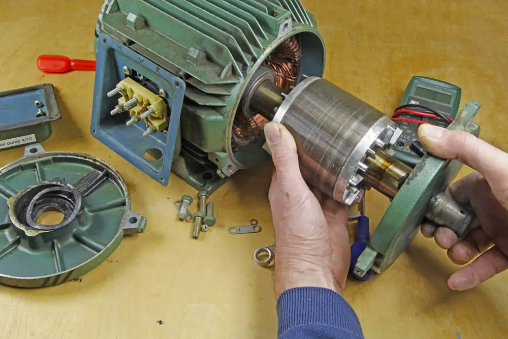 A technician performing professional motor repair services on an industrial motor in River Ridge, LA